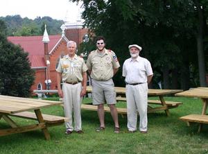 From left are Scoutmaster Thomas Fowlkes, Nathaniel Tayloe and Richard Rose, producing artistic director of Barter Theatre, standing with the three tables built by Tayloe.