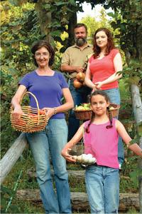 Barbara Kingsolver, her oldest daughter Camille, and her husband, Steven Hopp, co-authored Animal, Vegetable, Mineral. Also shown is youngest daughter Lily.  (Photo credit: Hank Daniel)