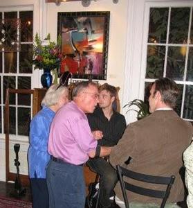 Guests chat during an opening reception at Lava Blue Gallery.