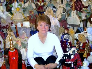 Susan Lilly is shown with some of her sewing creations.