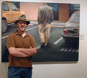 Perry Johnson stands in front of one of his paintings.