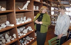 Kil'n Time owner Terry Gregory, left, and Sylvia Musgrove, manager and kiln master, talk Thursday about the new ceramics studio on State Street. (Photo by Andre Teague/Bristol Herald Courier)