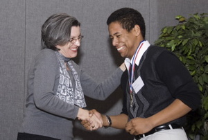 National Poetry Out Loud champion William Farley is congratulated by Virginia Poet Laureate Claudia Emerson.
