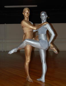 The silver dancer is Camille Clark and the gold dancer is Kelsey Nickels.