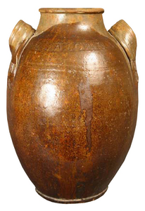 This jar by Greene County, Tenn. potter John Alexander Lowe set a record for Tennessee pottery at a Case Antiques Auction in 2008. Estimated at $12,000-$18,000, the redware jar sold for $63,000. The circa 1860 jar, with extruded handles, incised decoration at the handle attachments and stamped name circling its shoulders, is the only known intact Lowe jar in existence. (Photography by Jeffrey Stoner)