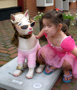 Jessica Rogers of Bristol, Tenn., poses with "Hollywolf Incognito," part of Abingdon's "Who's Afraid of Virginia Wolves" public art project.