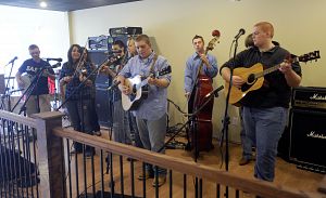 The Sullivan East High School bluegrass band performs Saturday during a free workshop at Morrell Music in Bristol, Tenn. (Photo by Andre Teague|Bristol Herald Courier)