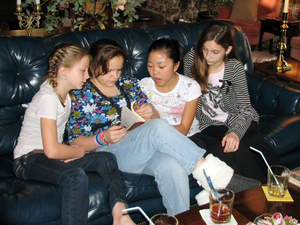 Youth book club members discuss Katherine Paterson's books. From left, they are Annie Osborne, Maria Poteat, Maleah Newton, and Lauren Lily. 