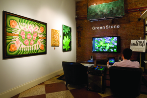 GreenStone Gallery uses iPad technology to showcase images on a 55-inch monitor (right) so artworks on file can be viewed life-size. (Photo by Jeffrey Stoner)