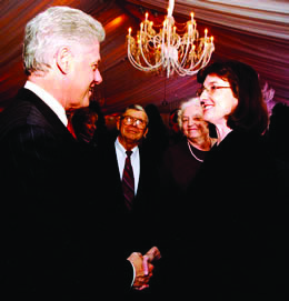 Barbara Kingsolver shakes hands with President Bill Clinton after receiving the National Humanities Medal. The award honors individuals or groups whose work has deepened the nation's understanding of the humanities, broadened our citizens' engagement with the humanities, or helped preserve and expand Americans' access to important resources in the humanities.