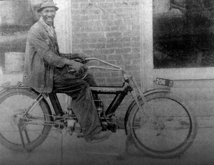 William Plummer on the bicycle he made.