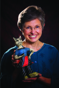 Sara Reese with one of her whimsical cats.