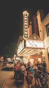 Theater-goers wait at the Paramount Theatre.