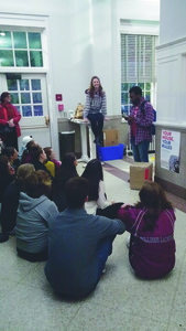 Madi Viterito and TJ Lewis perform in a 2015 pop up play in the downtown Boone Post Office