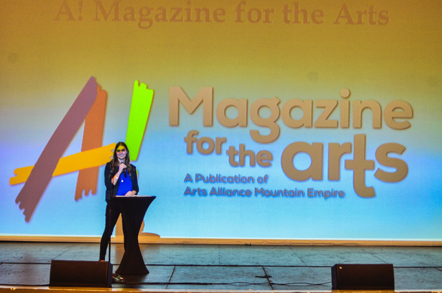 Erika Barker, AAME president, announces A! Magazine's new logo.
