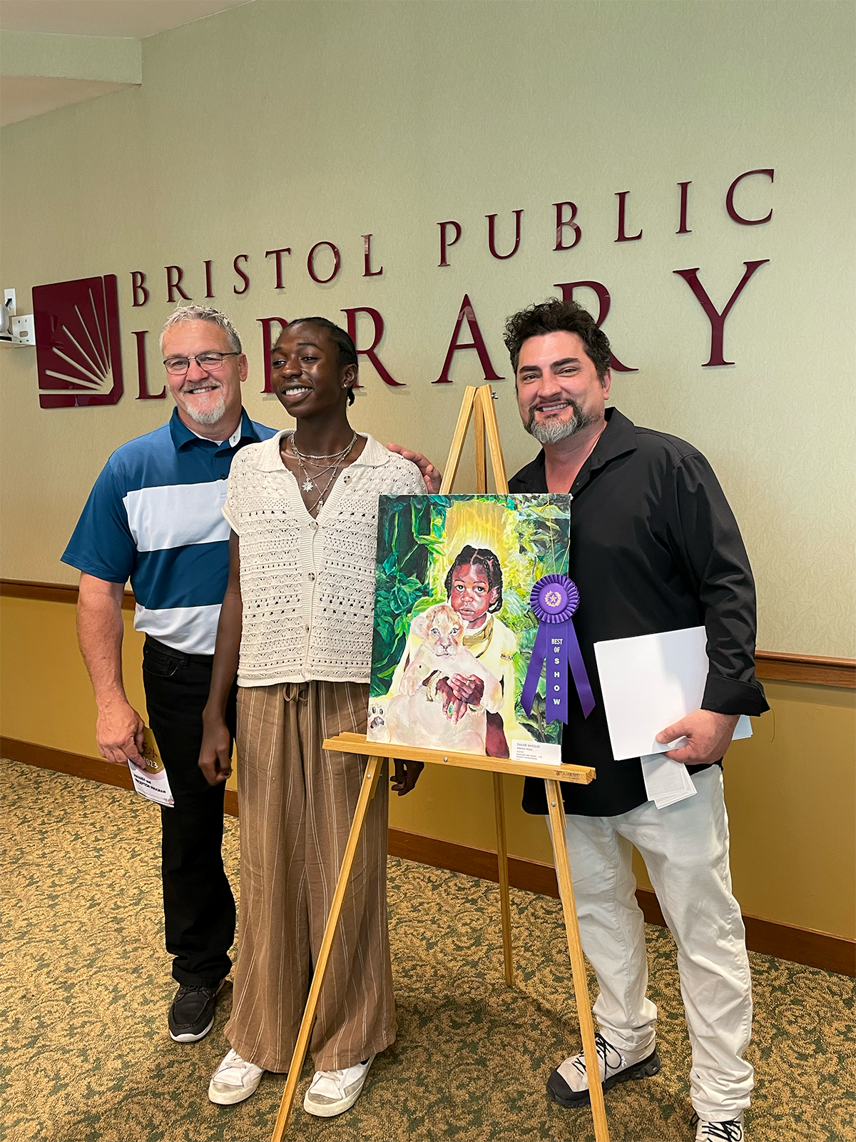 Shawn Graham (left) and Donnie Quales (right), Tennessee High School's art teachers with Dakari Wheeler (center), winner of "Best of Show"