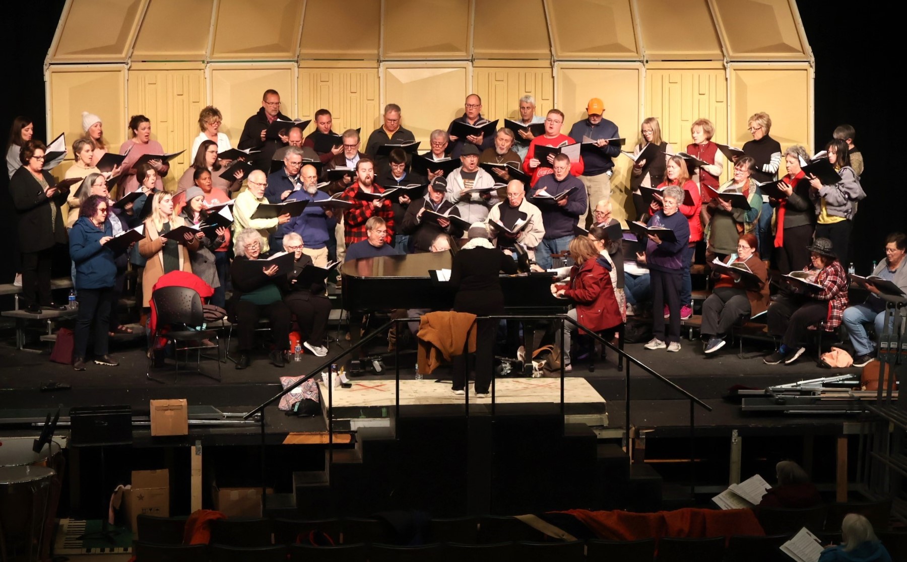 The Tusculum University Community Chorus rehearses on the stage in the Marilyn duBrisk Theatre of Annie Hogan Byrd Fine Arts Center.