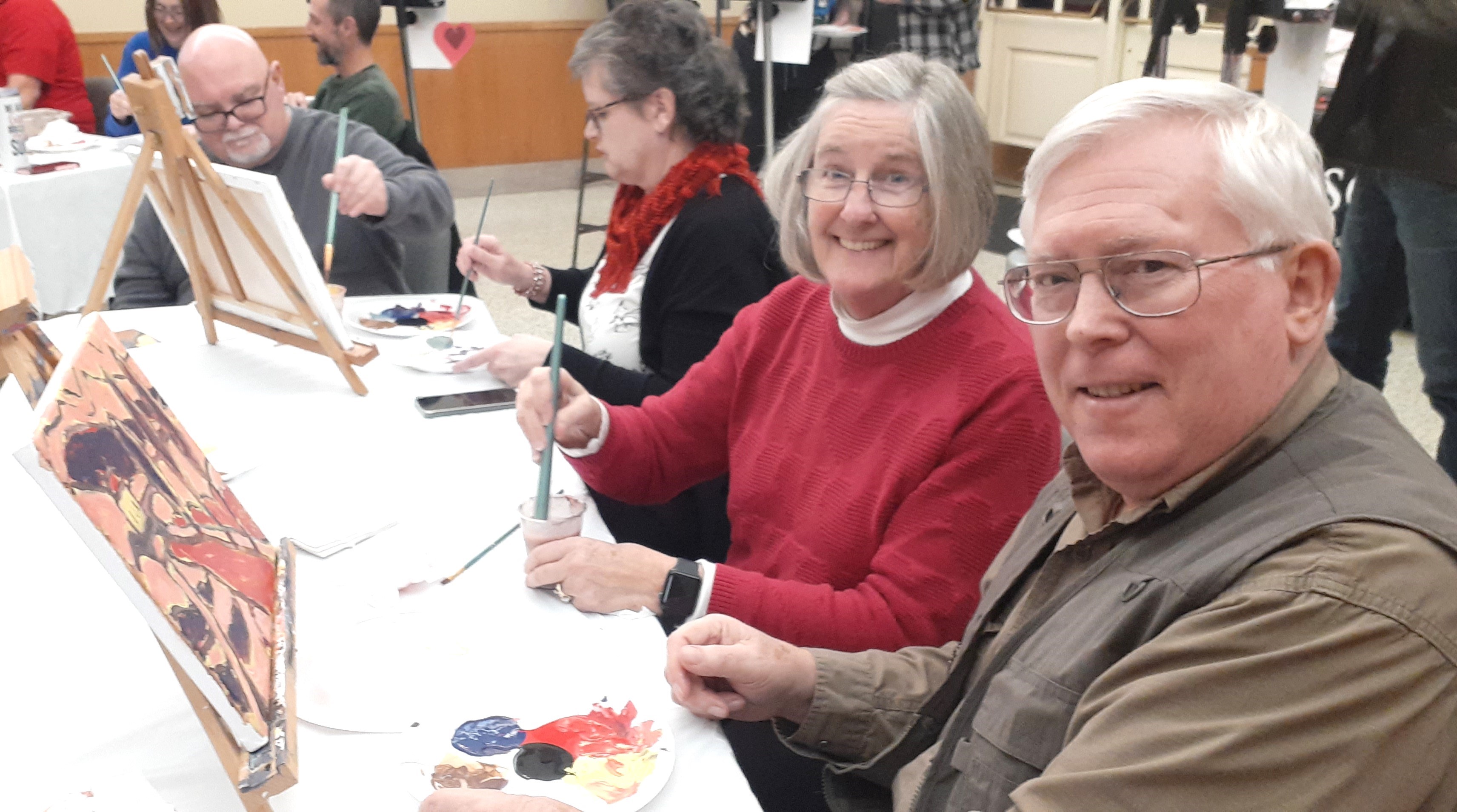 Community members enjoy painting.